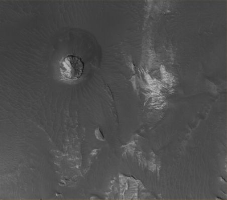Features of Eos Chaos: Circular Butte (Original NASA/MGS/MSSS b/w Frame - 1)
Original caption:"This MGS-MOC image shows light-toned, Layered Rock Outcrops in Eos Chaos, located near the East end of the Valles Marineris Trough System. The Outcrops occur in the form of a distinct, circular Butte (image 1) and a high Slope (image 2). The rocks might be sedimentary rocks, similar to those found elsewhere exposed in the Valles Marineris System and the Chaotic Terrain to the East of the Region".

Location near: 12,9° South Lat. and 49,5° West Long.  
Image width: ~3 Km (~1,9 mi)  
Illumination from: lower left  
Season: Southern Summer
Parole chiave: Mars from orbit - Eos Chasma