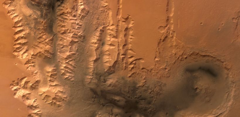 Tithonium Chasma - Valles Marineris
Caption ESA originale:"This image shows the western end of the canyons Tithonium Chasma and Ius Chasma, part of the Valles Marineris canyon system, which are up to 5,5 Km deep. 
The image was taken on 26 May 2004 during orbit 442 with a ground resolution of approximately 52 metres per pixel. The displayed region is located at the beginning of the canyon system at about latitude 7° South and longitude 269° East. North is to the left".
Parole chiave: Mars from orbit