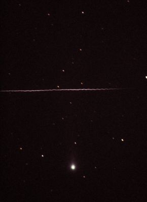 Comet Machholz and a "corkscrew" meteor
Caption NASA originale:"Meteor trains (train--->trajectory) that twist noticeably are rare but have been noted before. The underlying reason for unusual meteors trains is that many meteors are markedly non-spherical in shape and non-uniform in composition. Meteors, usually sand sized grains that originate in comets, will disintegrate as they enter the Earth's atmosphere. Non-uniform meteors may evaporate more on one side than another. This may cause a rotating meteor to wobble slightly in its path, and also to spray fast moving debris in a nearly spiral path. The fast moving meteor debris ionizes molecules in the Earth's atmosphere that subsequently glow when they reacquire elections. Surely no meteor is perfectly uniform and spherical, so that a slight swagger that is below perceptibility is likely typical. Meteors may well have seeded Earth with the prebiotic molecules that allowed for the development of life".
Parole chiave: Comets: images from Earth - Controversial Image