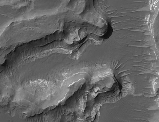 Eberswalde Crater and Delta (Sub-meter-per-pixel cPROTO - detail mgnf)
Original caption:"Even with the roll only targeted observation technique, it took more than one Earth year to build up a complete mosaic of images of the delta. In the meantime, the first data showing the deltaic landforms were archived and released to the public and scientific community, long before the MOC Team's analysis and mosaic were complete. Some scientists began independent analyses of the landform at that time. The initial analysis and announcement of the feature was finally published in November 2003. 
The Eberswalde delta provides the first clear, 'smoking gun' evidence that some valleys on Mars experienced persistent flow of a liquid with the physical properties of water over an extended period of time, as do rivers on Earth. In addition, because the delta today is "lithified" - that is, hardened to form rock - it provided the first unambiguous evidence that some martian sedimentary rocks were deposited in a liquid (presumably, water) environment. The presence of meandering channels, a cut-off meander, and crisscrossing channels at different elevations (one above the other), provided the clear geologic evidence for these interpretations".
Parole chiave: Mars from orbit - Craters