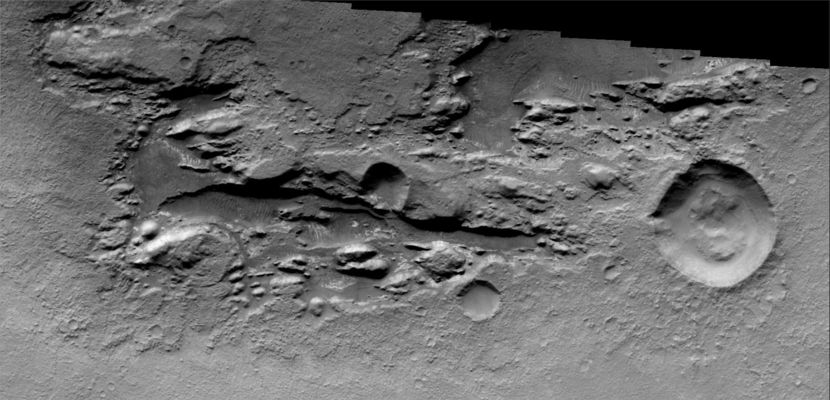 The Floor of Millochau Crater (Original NASA/JPL/ASU b/w Frame)
Original caption:"The Floor of Millochau Crater has been filled by material that is now being eroded away".

Image information: VIS instrument;
Coord.: 21,1° South Lat. and 85,6° East Long.
Resolution: 17 meter/pixel.
Parole chiave: Mars from orbit - Craters - Millochau Crater