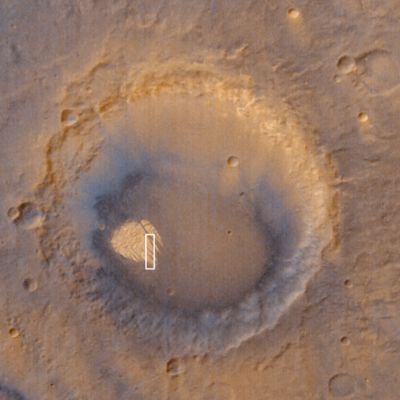 The "White Rock" inside Pollack Crater (NASA/JPL/MSSS)
Caption NASA originale:"White Rock" is a ridged mound that was first seen and informally named "White Rock" in pictures from the Mariner 9 orbiter in 1972. In black-and-white photos, the feature appears much brighter than its surrounding terrain, giving the impression that the material is white. Later analyses of Mariner 9, Viking and MGS data showed that the feature isn't actually white: it is somewhat red and reflects only about 20-25% of the sunlight that falls upon it (a white surface would reflect 100%). Located in Pollack Crater, a 95 Km wide impact basin at 7.9°S, 334.7°W, White Rock is the light-red/orange feature with the rectangular white box drawn on it in the context view. The light-toned material that gives White Rock its name forms steep cliffs with valleys between them covered by dark, windblown, rippled sand". 
Parole chiave: Mars from orbit - Craters - Pollack Crater