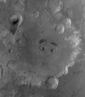 The "Eyes" and "Eyebrows" of Tikhonravov Crater (Original NASA/MGS/MSSS b/w Frame)
Caption NASA originale:"This red wide angle MGS-MOC image shows Tikhonravov Crater in Central Arabia Terra. The Crater is about 386 Km (approx. 240 miles) in diameter and presents two Unnamed Impact Craters at its center that have dark patches of Sand in them, giving the impression of pupils in two eyes. Each of these two Unnamed Craters lies a dark-toned patch of Surface Material, providing the impression of eyebrows. 
M. K. Tikhonravov was a leading Russian rocket engineer in the 20th Century. The crater named for him, despite its large size, is still partly buried, on its West Side, beneath the heavily Cratered Terrain of Arabia Terra. The center of Tikhonravov is near 13,5° North Lat. and 324,2° West Long. Sunlight illuminates the scene from the upper left".
Parole chiave: Mars from orbit - Craters - Tikhonravov Crater