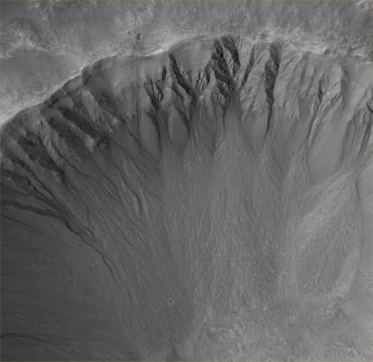 Unnamed Crater with Gullies in Terra Cimmeria (Original NASA/MGS/MSSS b/w Frame)
Caption NASA originale:"This MGS-MOC image shows an array of gullies in the North-NorthWest wall of a crater in Terra Cimmeria. These features may have been formed through the interaction of several processes including, but not limited to, mass wasting and/or seepage and runoff of groundwater".

Location near: 33,5° South Lat. and 207,2° West Long.
Image width: ~3 Km (~1,9 mi)  
Illumination from: upper left  
Season: Southern Summer
Parole chiave: Mars from orbit - Craters - Unnamed Crater with Gullies