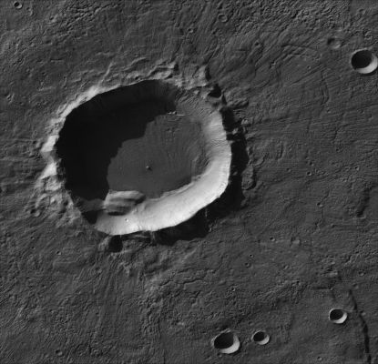 Crater in Terra Sirenum (1)
The largest number of gullies on Mars occur on the walls of southern hemisphere craters. During southern winter, many of the gullied walls are in shadow. It has been known for many years from Mars Global Surveyor Mars Orbiter Camera images that frost forms on these shadowed slopes and that differences in the amount or nature of the frost deposits highlight the gully floors and deposits. Such differences may occur because the materials are of different particle sizes, or have other differing attributes that affect their thermophysical properties. To investigate this phenomenon, CTX acquired this image of a crater at 39.3°S, 136.5°W, where gullies were known to display frost during winter. To see the gullies, download the image and view it in an image processing program, as they are nearly invisible in the normal contrast image.
Parole chiave: Mars from orbit - Craters - Terra Sirenum