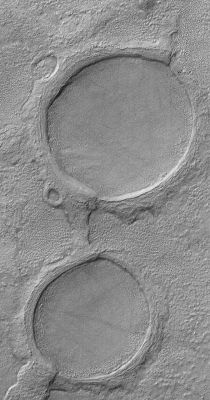 Martian "Spectacles"! (Original NASA/MGS/MSSS b/w Frame)
Caption NASA originale:"This MGS-MOC image shows a pair of partially-buried impact craters which are being exhumed on a plain east of Hellas in the Promethei Terra Region Mars".  

Location near: 45,5° South; 256,5° West
Image width: ~3 Km (~1,9 mi)  
Illumination from: upper left  
Season: Southern Autumn

Nota: "spectacles"---> occhiali
Parole chiave: Mars from orbit - Craters - Unnamed Southern Craters