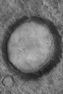 Unnamed Impact Crater wth "Black Rim" (Original NASA/JPL/MSSS b/w Frame)
Caption NASA originale:"This MGS-MOC image shows a nearly-filled (and very old) impact crater on the Northern Plains". 

Location near: 47,3° North Lat. and 294,0° West Long.
Image width: ~3 Km (~1,9 mi) 
Illumination from: lower left 
Season: Northern Summer 
Parole chiave: Mars from orbit - Craters - Unnamed Crater with Black Rim