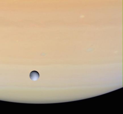 Dione and Saturn in natural colors
Caption NASA originale:"Cassini captured Dione against the globe of Saturn as it approached the icy moon for its close rendezvous on Dec. 14, 2004. This natural color view shows the moon has strong variations in brightness across its surface, but a remarkable lack of color, compared to the warm hues of Saturn's atmosphere. Several oval-shaped storms are present in the planet's atmosphere, along with ripples and waves in the cloud bands. 
The images used to create this view were obtained with the Cassini spacecraft wide-angle camera at a distance of approximately 603.000 Km from Dione through a filter sensitive to wavelengths of ultraviolet light centered at 338 nanometers. The Sun-Dione-spacecraft, or phase, angle is 34°. The image scale is about 32 Km per pixel".
Parole chiave: Saturn's Moons - Dione