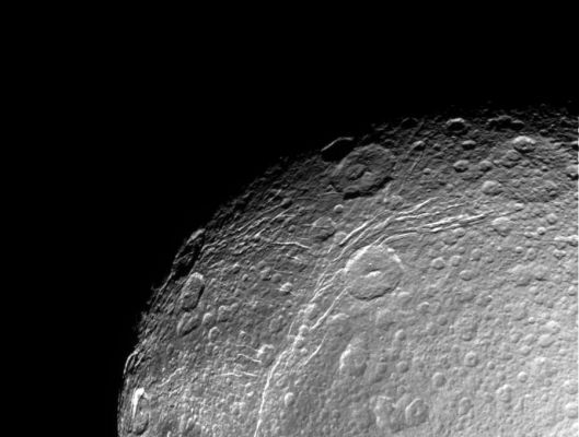 Dione: close-up (1) - HR
Caption NASA originale:"This incredible, HR view of Saturn's moon Dione was taken during Cassini's first close approach to the icy moon on Dec. 14, 2004. The view shows linear, curving features within the region of the bright wispy terrain Dione is known for. 
The image was obtained in visible light with the Cassini spacecraft narrow angle camera at a distance of approximately 156.000 Km (97.000 miles) from Dione. The Sun-Dione-spacecraft, or phase, angle is 34°. The image scale is about 1 Km (0.6 miles) per pixel".
Parole chiave: Saturn's Moons - Dione