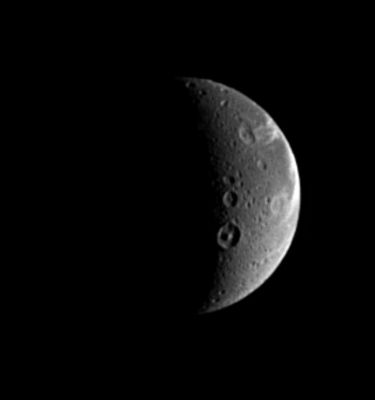 Dione: the "Aeneidian Moon", from 1,1 MKM
Original caption:"When naming features on other worlds, scientists like to follow themes, and Dione is no exception. Dione possesses numerous features with names from Virgil's 'Aeneid'. The prominent crater showing a central peak below the center is Dido, a 118-Km-wide (about 73-mile) crater named after the supposed founder of Carthage. The crater just above Dido is Antenor, an 82-Km-wide (about 51-mile) impact crater named after the nephew of Priam who founded the Italian city of Padua. At the upper right is the 97-Km-wide (about 60-mile) impact crater Turnus, which lies at the western end of Carthage Linea, a region of bright, fractured terrain. The sunlit terrain seen here shows some of the wispy markings on the Moon's trailing hemisphere. Cassini revealed that these markings are actually a complex system of fractures. North on Dione is up and rotated 25° to the left (...)".
Parole chiave: Saturn's Moons - Dione