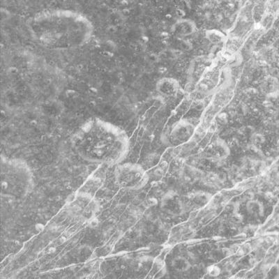 Dione: Carthage Linea
Dione's icy surface is scarred by craters and sliced up by multiple generations of geologically-young bright fractures. Numerous fine, roughly-parallel linear grooves run across the terrain in the upper left corner. Most of the craters seen here have bright walls and dark deposits of material on their floors. As on other Saturnian moons, rockslides on Dione may reveal cleaner ice, while the darker materials accumulate in areas of lower topography and lower slope (e.g. crater floors and the bases of scarps). 
The terrain seen here is centered at 15,4° North Latitude, 330,3° West Longitude, in a Region called Carthage Linea. North on Dione is up and rotated 50° to the left. 

The image was taken in visible green light with the Cassini narrow-angle camera on Oct. 11, 2005, at a distance of approx. 19.600 Km (roughly 12.200 miles) from Dione. The image scale is about 230 mt (760 feet) per pixel".
Parole chiave: Saturn's Moons - Dione - Carthage Linea
