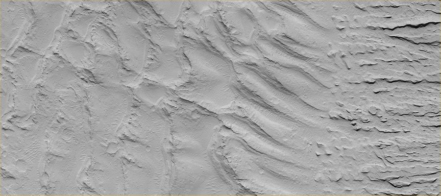 Paleodunes (2 - Original NASA/MGS/MSSS b/w Frame)
Caption NASA:"A similar effect at a much smaller scale can be seen by examining some Sandstones and Siltstones on Earth (if conditions were right, ripples formed in either water or wind are preserved in such rocks). The first MOC view, labeled M03-00006, was taken on July 1, 1999. The second view, M07-05007, was acquired September 26, 1999. Both MOC images are illuminated from the left. The Dunefield is located East of the Apollinaris Patera volcano and North-East of Gusev Crater (at about 12,5° South Lat. and 181° West Long.)".
Parole chiave: Mars from orbit - Paleodunes