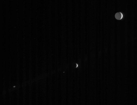 Moons...
Caption NASA proginale:"Four of Saturn's many and varied moons crowd this single frame from Cassini. 
All of the moons are illuminated by the Sun, which is out of the frame to the right. "Saturnshine", or reflected light from the planet (out of frame to the lower left), partly illuminates three of the moons, such as Tethys (1.071 Km, or 665 miles across, at upper right), Janus (181 Km, or 113 miles across, at lower left) and Epimetheus (116 Km, or 72 miles across, below and left of center). 
Enceladus (505 Km, or 314 miles across) is much farther in the distance in this view, and shows merely a slim crescent below center. 

The image was taken in visible light with the Cassini spacecraft narrow-angle camera on April 17, 2006, at a distance of approx. 3,7 MKM (such as about 2,3 MMs) from Saturn. The image scale is approx. 27 Km (about 17 miles) per pixel on Tethys, 21 Km (13 miles) per pixel on Enceladus, and 22 Km (14 miles) per pixel on Janus and Epimetheus".
Parole chiave: Saturn's Moons - Janus, Epimetheus, Tethys and Enceladus