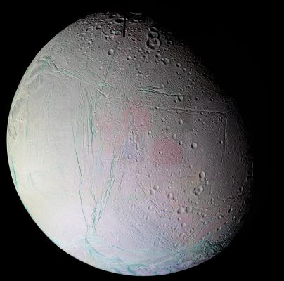 Enceladus (in false colors)
The mosaic shows the anti-Saturnian Hemisphere of Enceladus -- the side that always faces away from Saturn. 
This Region contains a number of tectonic and impact features and shows how these two geologic forces interact on Enceladus. The center left portion of this mosaic is dominated by Diyar Planitia. 
Like Sarandib Planitia observed in the previous Enceladus flyby, the Region is characterized by low ridges and troughs. Throughout this Hemisphere, fractures of all sizes disrupt the previously existing cratered terrain and even the comparatively youthful Diyar Planitia. 
Many of the younger fractures have blue-green walls, revealing coarse-grained water ice in the top layers of Enceladus' lithosphere, compared to the fine-grained ice that coats much of Enceladus' surface. The blue-green color is very similar to the coatings surrounding the South Polar "tiger stripes" (these appear greener than the features in the south polar mosaic released in 2005 due to the use of clear-filter images, instead of green, in that mosaic). 
Parole chiave: Saturn's Moons - Enceladus