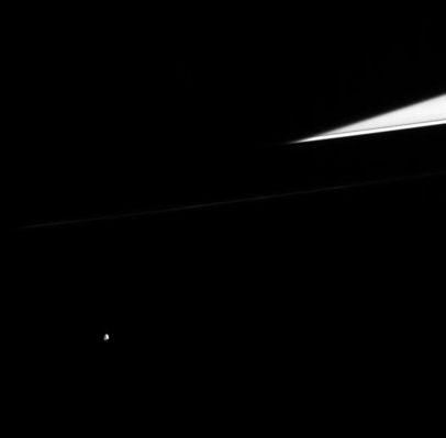 Epimetheus in the darkness...
Original caption:"Small, multi-faceted Epimetheus wanders into Cassini's field of view, while Saturn's dark shadow cuts across the ringplane. Only a sliver of the outer A-Ring is seen here, including the narrow Keeler Gap. Epimetheus is a moon that is 116 kilometers (72 miles) across. 
This view is from 10° out of the ringplane, gazing toward the lit face of the Rings. 
The image was taken in visible light with the Cassini spacecraft narrow-angle camera on Aug. 31, 2005, at a distance of approximately 2,1 MKM (such as about 1,3 MMs) from Epimetheus and at a Sun-Epimetheus-spacecraft, or phase, angle of 60°. Resolution in the original image was 13 Km (about 8 miles) per pixel".
Parole chiave: Saturn's Moons - Epimetheus