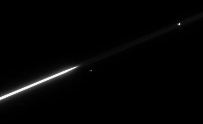 The "Runners"...again!
Janus and Epimetheus continue to separate, following their orbital swap in January 2006. Until 2010, Janus will remain the innermost of the pair, whose orbits around Saturn are separated by only about 50 Km (such as approx. 31 miles) on average. 
Epimetheus appears just right of the bright A-Ring ansa, or edge, while Janus is seen near the upper right. The faint F-Ring extends across the image and Janus appears directly between its near and far edges. 

The image was taken in visible light with the Cassini spacecraft narrow-angle camera on April 16, 2006, at a distance of approx. 3,7 MKM (such as about 2,3 MMs) from Saturn. The image scale is approx. 22 Km (about 14 miles) per pixel on both Janus and Epimetheus.
Parole chiave: Saturn's Moons - Janus and Epimetheus