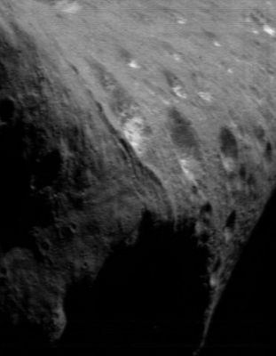 The North Pole of Eros
Caption NASA originale:"For a long time, imaging activities on the NEAR Shoemaker spacecraft have focused on the high northern latitudes of Eros. The point at which the Sun is directly overhead - known as the "subsolar point" - has been steadily moving from Eros' Northern Regions toward the equator as the asteroid's seasons progress. As this happens, the Northern Hemisphere is illuminated less and less and previously dark southern latitudes progressively come into view. In this image, taken March 19, 2000, from a range of 205 Km (approx. 127 miles), the asteroid's North Pole is in the upper right of the frame. The whole scene is 7,4 Km (approx. 4,6 miles) across".
Parole chiave: Asteroids: images from Space