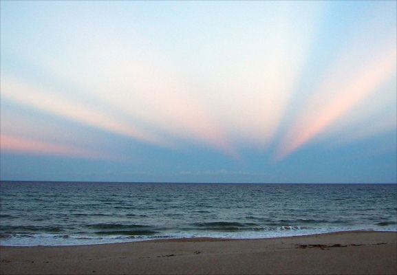 Infinite
Caption NASA originale:"(...) Pictured above are anticrepuscular rays. 
To understand them, start by picturing common crepuscular rays that are seen any time that Sunlight pours though scattered clouds. Now although Sunlight indeed travels along straight lines, the projections of these lines onto the spherical sky are great circles. Therefore, the crepuscular rays from a setting (or rising) Sun will appear to re-converge on the other side of the sky. 
At the anti-solar point 180° around from the Sun, they are referred to as anticrepuscular rays (...)". 
Parole chiave: The Universe Inside