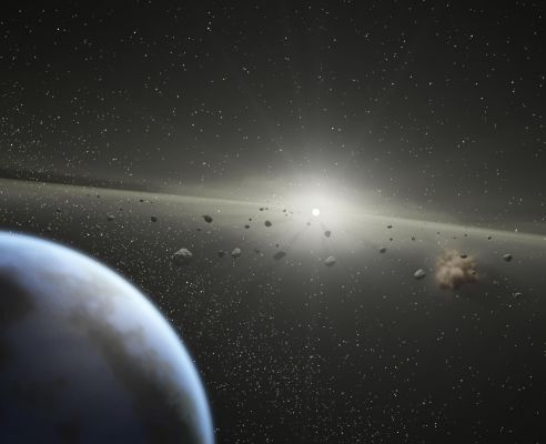 Supermassive "Asteroid Belt" around Star HD 69830
Caption NASA originale:"This artist's conception illustrates a massive Asteroid Belt in orbit around a star the same age and size as our Sun. 
Evidence for this possible belt was discovered by NASA's SST when it spotted warm dust around the star, presumably from asteroids smashing together. 
The view starts from outside the belt, where planets like the one shown here might possibly reside, then moves into to the dusty belt itself. Collisions between asteroids replenish the dust in the Asteroid Belt, making it detectable to SST. 
The alien belt circles a faint, nearby star called HD 69830 located 41 LY away in the constellation Puppis. Compared to our own Solar System's Asteroid Belt, this one is larger and closer to its star - it is 25 times as massive and lies just inside an orbit which is equivalent to the one of Venus while our Asteroid Belt circles between the orbits of Mars and Jupiter. 
Because Jupiter acts as an outer wall to our asteroid belt, shepherding its debris into a series of bands, it is possible that an unseen planet is likewise marshalling this belt's rubble. Previous observations using the radial velocity technique did not locate any large gas giant planets, indicating that any planets present in this system would have to be the size of Saturn or smaller".
Parole chiave: Artistic Views of the Universe