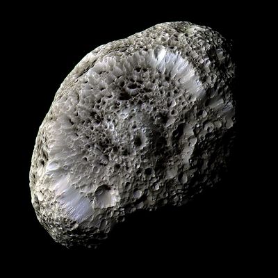 Hyperion - false colors
Original caption:"This stunning false-color view of Hyperion reveals crisp details across the strange, tumbling moon's surface. Differences in color could represent differences in the composition of surface materials. The view was obtained during Cassini's close flyby on Sept. 26, 2005. 
Hyperion has a notably reddish tint when viewed in natural color. The red color was toned down in this false-color view and the other hues were enhanced, in order to make more subtle color variations across Hyperion's surface more apparent. 
Images taken using infrared, green and ultraviolet spectral filters were combined to create this view. The images were taken with the Cassini spacecraft's narrow-angle camera at a distance of approx. 62.000 Km (about 38.500 miles) from Hyperion and at a Sun-Hyperion-spacecraft angle of 52°. 
The image scale is 362 mt (about 1200 feet) per pixel".
Parole chiave: Saturn's Moons - Hyperion