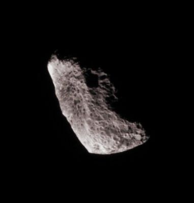 Pumice-Hyperion (natural colors - elab. Lunexit)
Caption NASA:"Chaotically tumbling and seriously eroded by impacts, Hyperion is one of Saturn's more unusual satellites. Scientists believe the moon to be quite porous, with a great deal of its volume being empty space. 
(...) Only part of the moon is visible in this image, the rest being hidden in shadow. 

The image was taken with the Cassini spacecraft narrow-angle camera using a spectral filter sensitive to wavelengths of infrared light centered at 930 nanometers. The view was acquired on Feb. 15, 2007 from a distance of approx. 224.000 Km (such as about 139.000 miles) from Hyperion. 
Image scale is roughly 1 Km (4.404 feet) per pixel". 
Parole chiave: Saturn's Moons - Hyperion
