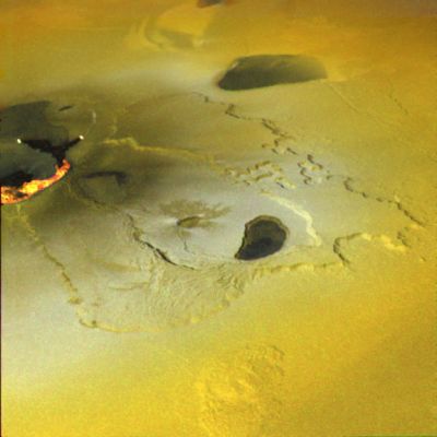 Io (Flying over a volcanic eruption and a sea of sulphur - Tvashtar Catena)
An active volcanic eruption on Jupiter's moon Io was captured in this image taken on February 22, 2000 by NASA's Galileo spacecraft. Tvashtar Catena, a chain of giant volcanic calderas centered at 60 degrees north, 120 degrees west, was the location of an energetic eruption caught in action in November 1999. A dark, "L"-shaped lava flow to the left of the center in this more recent image marks the location of the November eruption. White and orange areas on the left side of the picture show newly erupted hot lava, seen in this false color image because of infrared emission. The two small bright spots are sites where molten rock is exposed to the surface at the toes of lava flows. The larger orange and yellow ribbon is a cooling lava flow that is more than more than 60 kilometers (37 miles) long. Dark, diffuse deposits surrounding the active lava flows were not there during the November 1999 flyby of Io.

This color mosaic was created by combining images taken in the near-infrared, clear, and violet filters from Galileo's camera. The range of wavelengths is slightly more than that of the human eye. The mosaic has been processed to enhance subtle color variations. The bright orange, yellow, and white areas at the left of the mosaic use images in two more infrared filters to show temperature variations, orange being the coolest and white the hottest material. This picture is about 250 kilometers (about 155 miles) across. North is toward the top and illumination from the Sun is from the west (left).

Parole chiave: Jupiter's moons - Io
