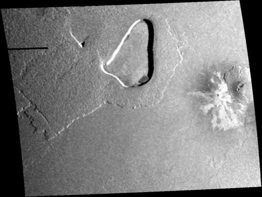 Volcanic Depression near the Equator (Original NASA/Galileo b/w Frame)
This image taken by NASA's Galileo spacecraft on Oct. 16, 2001, near the equator of Jupiter's moon Io shows the contrast in volcanism styles found on Io.

The central feature is a large patera, or volcanic depression, almost 100 kilometers (60 miles) long. It may have formed after eruptions of lava emptied a subsurface magma chamber and left an empty space into which the crust collapsed. Evidence of lava flows associated with this patera, however, is difficult to find. Either the flows have been buried, or perhaps they never erupted and simply drained back deep into the crust.

On the right of the image is a small shield volcano, similar to volcanoes in Hawaii. It is rare for lavas on Io to be thick enough to pile up into shields around vents. They usually run out in thin, long flows instead. This shield abuts some very pale lava flows that emerged from a small vent to the west. These flows could be made of sulfur, like flows at Io's Emakong Patera. The vent is also surrounded by dark, diffuse material, which may be the result of lava erupted in an explosive, gas-rich eruption, similar to the 1980 eruption of Mount Saint Helens in Washington.

North is to the top of the image and the illumination is from the right. The image has a resolution of 330 meters (1,080 feet) per picture element and is 340 (211 miles) kilometers across.


Parole chiave: Jupiter's moons - Io