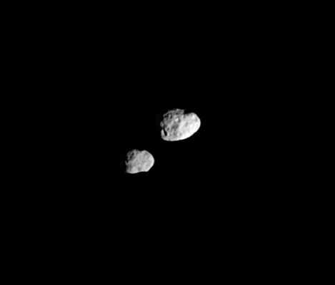 Janus, Epimetheus and the "Orbital Switch"
Caption NASA originale:"In their orbital ballet, Janus and Epimetheus swap positions every four years - one moon moving closer to Saturn, the other moving farther away. The two recently changed positions (the swap occurring on January 21, 2006), and Janus will remain the innermost of the pair until 2010, when they will switch positions again. 
Although the moons appear to be close in the image, they are not. Janus is about 40.000 Km (appx. 25.000 miles) farther away from Cassini than Epimetheus (at left) in this view. In fact, even when they are at their closest, tugging at each other and swapping orbital positions, they are never closer than about 15.000 Km (about 9.000 miles). 

The image was taken in visible light with the Cassini spacecraft narrow-angle camera on March 20, 2006 at a distance of approx. 452.000 Km(about 281.000 miles) from Epimetheus and 492.000 Km (about 306,000 miles) from Janus. The image scale is about 3 Km (appx. 2 miles) per pixel on both moons".
Parole chiave: Saturn's Moons - Janus and Epimetheus