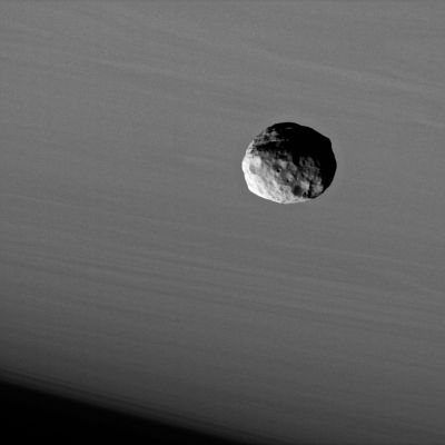 Janus, from VERY close!
Caption NASA:"The Cassini spacecraft provides this dramatic portrait of Janus against the cloud-streaked backdrop of Saturn. 
Like many small bodies in the Solar System, Janus (about 181 Km, such as approx. 113 miles across) is potato-shaped with many craters, and the moon has a surface that looks as though it has been smoothed by some process. 
Like Pandora and Telesto, Janus may be covered with a mantle of fine dust-sized, icy material. 

The image was taken using a spectral filter sensitive to wavelengths of infrared light centered at 930 nanometers. 

This view was acquired with the Cassini spacecraft narrow-angle camera on Sept. 25, 2006 at a distance of approx. 145.000 Km (such as about 90.000 miles) from Janus and at a Sun-Janus-spacecraft, or phase, angle of 62°. North on Saturn is up. Image scale is roughly 871 mt (about 2.858 feet) per pixel".
Parole chiave: Saturn's Moons - Janus