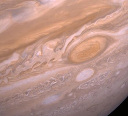 The "Red Spot" of Jupiter
Caption NASA originale:"The region of white clouds now extends from east of the Red Spot and around its northern boundary, preventing small cloud vortices from circling the feature. The disturbed region west of the Red Spot has also changed since the equivalent Voyager 1 image. It shows more small scale structure and cloud vortices being formed out of the wave structures. The picture was taken on July 3, 1979, from about 6 MKM".
Parole chiave: Jupiter