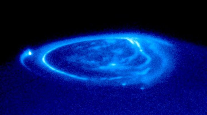 Jupiter's Aurora - HST
Caption NASA originale:"Auroras are curtains of light resulting from high-energy electrons racing along the planet's magnetic field into the upper atmosphere. 
The electrons excite atmospheric gases, causing them to glow. 
The image shows the main oval of the aurora, which is centered on the magnetic north pole, plus more diffuse emissions inside the polar cap. The HST image shows also unique emissions from the magnetic "footprints" of 3 of Jupiter's largest moons. 
Auroral footprints can be seen in this image from Io (along the lefthand limb), Ganymede (near the center), and Europa (just below and to the right of Ganymede's auroral footprint). 
These emissions, produced by electric currents generated by the satellites, flow along Jupiter's magnetic field, bouncing in and out of the upper atmosphere". 
Parole chiave: Hubble Images - Jupiter