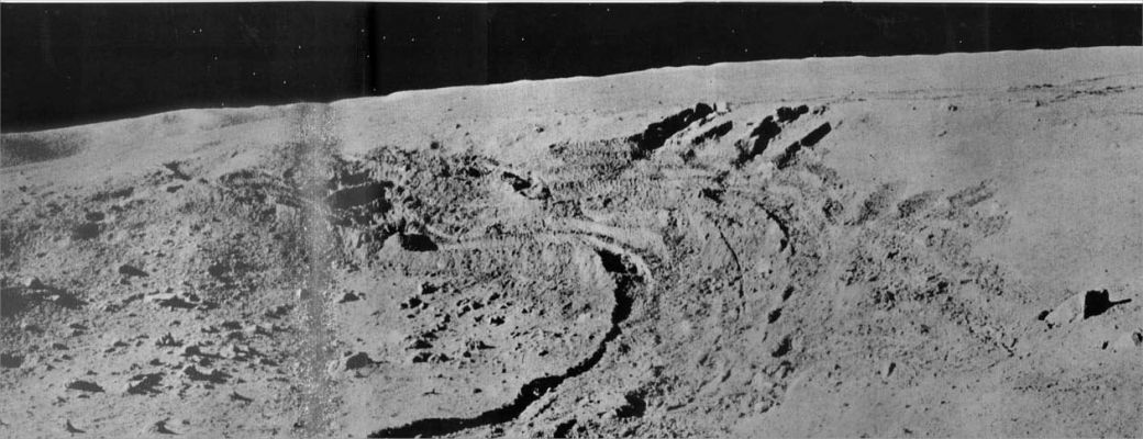 Rover tracks and the far distant walls of LeMonnier Crater
After landing, the Lunokhod-2 took TV images of the surrounding area, then rolled down a ramp to the surface at 01:14 UT on 16 January and took pictures of the Luna 21 Lander and Landing Site. It stopped and charged batteries until 18 January, took more images of the Lander and Landing Site, and then set out over the Moon. The Rover would run during the Lunar Day, stopping occasionally to recharge its batteries via the solar panels. At night the Rover would hibernate until the next sunrise, heated by the radioactive source. Lunokhod-2 operated for about 4 months, covered 37 Km of terrain, including hilly upland areas and rilles, and sent back 86 panoramic images and over 80.000 TV pictures. 
Many mechanical tests of the surface, laser ranging measurements and other experiments were completed during this time. 
Parole chiave: Moon Panorama - LeMonnier Crater