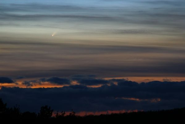Comet McNaught (2)
Caption NASA:"The brightest comet in decades is unexpectedly now visible. The most optimistic predictions have Comet McNaught (C/2006 P1) shortly becoming one of the brightest comets of the past century. For the next few days, its short tail and bright coma can be spotted with the unaided eye close to the Sun and near the horizon in both evening and morning skies. This dramatic picture of the comet shining through cloudy skies was taken near sunset on January 7, 2007, from Bad Mergentheim, Germany". 
Parole chiave: Comet McNaught