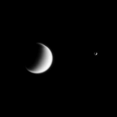 Big Brother, Little Brother...
Original caption:"Titan, the Saturn's largest moon and Mimas - in the foreground - are seen together in this view from Cassini. 
Titan's gravity is weaker than Earth's, so the moon's atmosphere is quite extended - a "quality" that is very well hinted at in this view. 

Part of Mimas' dark side is illuminated by reflected light from nearby Saturn. 

The image was taken in visible light with the Cassini spacecraft narrow-angle camera on Dec. 3, 2005, at a distance of approx. 3,6 MKM (about 2,2 MMs) from Titan and 2,5 MKM (1,6 MMs) from Mimas. 
Both moons are seen at a phase angle of 110°. 
The image scale is 22 Km (roughly 14 miles) per pixel on Titan and 15 Km (about 9 miles) per pixel on Mimas".
Parole chiave: Saturn's Moons - Mimas and Titan
