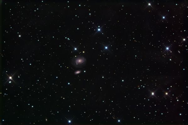 NGC 1 and 2
"Professor does cold exist?" 
The professor replied "Of course it exists. Have you never been cold?" 
The students snickered at the young man's question. 
The young man replied, "In fact sir, cold does not exist. According to the laws of physics, what we consider cold is in reality the absence of heat. Everybody or object is susceptible to study when it has or transmits energy, and heat is what makes a body, or matter, have or transmit energy. 
Absolute zero (- 460 degrees F) is the total absence of heat. Cold does not exist. We have created this word only to describe how we feel if we have no heat".
The student continued. "Professor, does darkness exist?"   
The professor responded, "Of course it does."
The student replied, "Once again you are wrong sir. Darkness does not exist either. Darkness is in reality the absence of light. Light we can study, but not darkness. In fact we can use Newton's prism to break white light into many colors and study the various wavelengths of each color.
You cannot measure darkness. A simple ray of light can break into a world of darkness and illuminate it.  How can you know how dark a certain space is? You measure the amount of light present. Isn't this correct? Darkness is a term used by man to describe what happens when there is no light present".
Parole chiave: From Earth Images