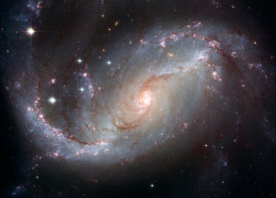 Barred Spiral Galaxy NGC 1672
"...The babe in the cradle is closing his eyes
The blossom embraces the bee.
But soon, says a whisper:
Arise, arise,
Tomorrow belongs to me..."

Dal Musical "Cabaret"
Parole chiave: From Space Images - Hubble Images