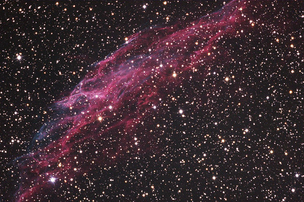 NGC 6992
Sometimes, just before the sleep comes around me
Sweeping my eyes away, with his images
His dreams, his subtle metaphores and 
His often obscure allegories that
Even though I try, striving beyond my limits, 
I cannot understand and I never will,
I turn my eyes to God, so beautiful and yet 
So far, sometimes,
And sometimes so close that, in the rapture 
That divides watching from sleeping,
It seems to me that I could touch Him 
And so, then, I barely touch Him:
But is only a reflection, elusive and flickering,
Like a portrait painted on water,
A portrait that even the sweetest and slightest touch 
Shall inevitably shatter away…
And it really does not matter if that portrait, like a spell,
Shall rebuild itself once again and again, for maybe a million times,
The Artist does not care if his art, so perfect, 
Must remain untouchable and elusive...

Some other times, before the sleep may catch me,
I turn my eyes to myself,
That myself who’s a Saint and a Sinner 
So small and yet so great 
Hidden inside me 
Maybe better than me...

And so, in the darkness of the Night that surrounds me 
Swept away by my thoughts 
And by my memories, now so close and then so far 
Tired, because of my fears and anxieties,
I indulge myself up to the waves of the hours 
Hours that come and go, in a strange procession,
Too slow or too fast,
But not a single hour, anyway, lasts an hour only 
In the Night that surrounds me 
When my soul gropes in the darkness...

A starless and silent Night 
A peaceful and yet shattered Universe 
One beginning and one end, so close,
As close as the trails and the lights 
Of a beautiful new Town, that is waiting for me 
At the end of this road...
And so, in that peace that only the Awareness,
When enlightened by Pain and Hope can give,
I realize that nothing is really important 
And, in the same time, that everything must be...

The face of an ant reminds me of buried brothers 
Buried in the sand and fog of Time that has gone by
I cannot see them, but I can hear their voices:
They whisper the sweetest words 
And so my eyes, flooded by useless tears, close.

And finally, there’s only the Night.

Paolo C. Fienga - "Poesie"
Parole chiave: From Earth Images - Amateur pictures