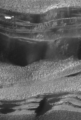 North Polar Layers
Caption NASA originale:"This view shows the basal layers of Mars' north polar layered deposits. The floor of Chasma Boreale is at the bottom of the image. This is a sub-image of a larger view imaged by the High Resolution Imaging Science Experiment (HiRISE) on NASA's Mars Reconnaissance Orbiter on Oct. 1, 2006. The resolution is 64 cm (about 25") per pixel, and the scene is 568 mt (approx. 621 yards) wide". 
Parole chiave: Mars from orbit - North Polar Features - Layers