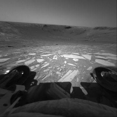 Perching on the edge... - Sol 133
Siamo alla 'porta' (anzi: sul 'bordo') di Endurance Crater e la Front HazCam del Rover ci regala questa meravigliosa ripresa che, nonostante presenti la consueta deformazione stroboscopica tipica di tutte le immagini provenienti dalla  Front e dalla Rear HazCam, entra di pieno diritto nella Galleria dei "Top-10 Mars Frames" di tutti i tempi.

Caption NASA originale:"Perched on the edge of Endurance Crater, NASA's Mars Exploration Rover Opportunity prepares to roll all 6 wheels in and then back out to the rim as an engineering test to ensure that the slope and rock surface meet expectations. 
The Rover executed the maneuver successfully and proceeded farther into the Crater the following day. This image was taken by the Rover’s Front Hazard-Avoidance Camera during Opportunity's 133rd Sol, on June 8, 2004".
Parole chiave: Endurance Crater