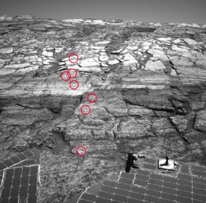 Inside Endurance Crater - Sol 169
La risposta al quesito posto dagli Amici della NASA con il precedente frame è 7, I "RAT's Holes" sono 7.

EccoVi la caption NASA originale:"NASA's MER Opportunity's RAT has nibbled 7 holes into the slope of Endurance Crater. This image from the Rover's NavCam was released previously (PIA06716) without the holes labeled so that Viewers could try to find the holes themselves. Here, the holes have been identified. Starting from the uppermost pictured (closest to the Crater's rim) to the lowest, the RAT's holes targets are: 
1) Tennessee, 
2) Cobblehill, 
3) Virginia, 
4) London, 
5) Grindstone, 
6) Kettlestone and 
7) Drammensfjorden. 
These holes were drilled on Sol 138 (June 13, 2004), 143 (June 18), 145 (June 20), 148 (June 23), 151 (June 26), 153 (June 28) and 161 (July 7), respectively. Each hole is 4,5 cm (about 1,8") in diameter".
Parole chiave: Endurance Crater - The Inner Walls