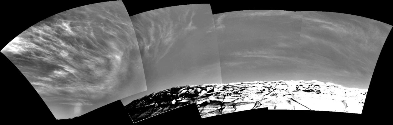 Martian clouds over Endurance Crater (1)
Caption NASA originale:"Clouds add drama to the sky above Endurance Crater in this mosaic of frames taken by the navigation camera on NASA's Mars Exploration Rover Opportunity at about 9:30 a.m. on the rover's 290th sol (Nov. 16, 2004). The view spans an arc from east on the left to the southwest on the right. 
These clouds are part of a band that forms near the equator when Mars is near the part of its orbit that is farthest from the Sun. For Opportunity (and Spirit and the rest of the southern hemisphere), this occurs in late fall and early winter. During this period, atmospheric temperatures and the amount of water vapor combine to form large-scale clouds. These clouds look like Earth's cirrus clouds and share other similarities with cirrus clouds in that they are believed to be composed entirely of water-ice particles with sizes on the order of several micrometers (a few ten-thousandths of an inch)".
Parole chiave: Martian clouds - Area Meridiani Planum