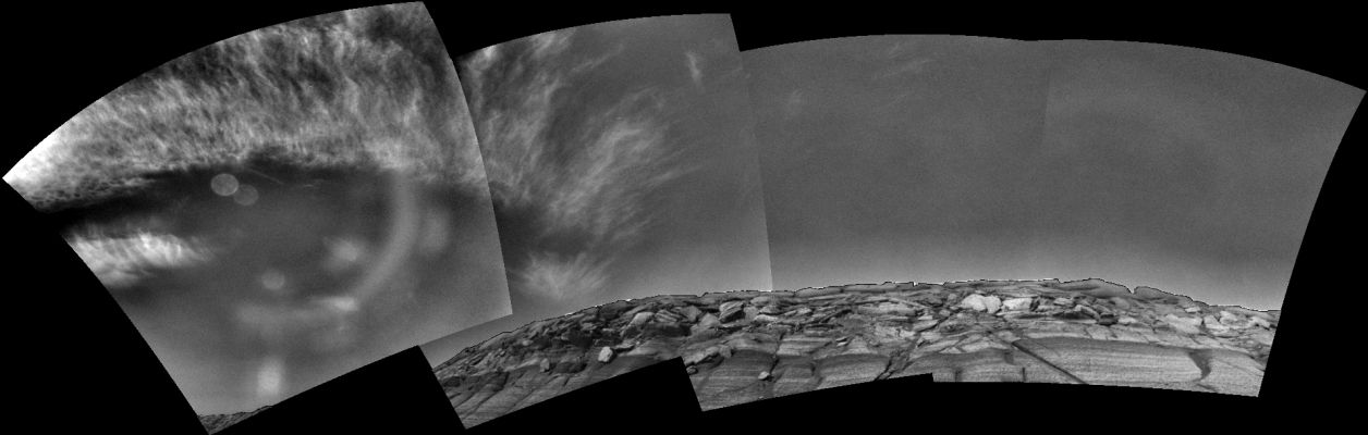 Martian clouds over Endurance Crater (2)
caption NASA originale:"Clouds appear in the martian sky above Endurance Crater in this mosaic of frames taken by the NavCam on NASA's Mars Exploration Rover Opportunity during the morning of the Rover's 291st sol (Nov. 17, 2004). The view spans an arc from the east on the left to the southwest on the right. 
Opportunity has observed differences in cloudiness from one sol to the next, a reminder that Mars, like Earth, has daily weather as well as longer-term seasonal changes. 
The images that are combined to produce this view have been processed to remove geometrical distortion associated with the camera's 45-degree field of view. In addition, special image processing has been applied to the original images to enhance the clouds and make them visible across the entire mosaic. Glare from the Sun washed out the clouds on the left in the original images; this glare was removed. The rim of Endurance has been processed separately and merged back with the sky to better show the context".
Parole chiave: Martian clouds - Meridiani Planum
