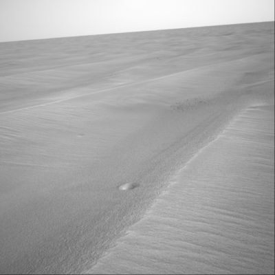 The comments af NASA about the "mini-craters" - Sol 437
E' con grande soddisfazione che riportiamo i commenti ufficiali NASA sulla scoperta dei 2 mini-crateri di Meridiani poichè, come potrete verificare, le loro supposizioni combaciano con le nostre. Questa piccola - ma significativa - identità di vedute ci conforta sulla validità delle nostre conoscenze scientifiche e capacità deduttive e ci spinge inoltre a proseguire, con sempre nuovi entusiasmi, nella ricerca di qualche tassello ulteriore da inserire nel mosaico del passato, del presente e, forse, anche del futuro del Pianeta Rosso.
Caption NASA:"Given that these 2 craters haven't been covered by sand even though they are surrounded by sand ripples on a flat plain lends support to the idea that they're fairly recent. Of course recent might mean any time from yesterday to 100 MY ago. Both are impact craters formed either by an object from space that was large enough to make it through the Martian atmosphere without burning up or by rock fragments ejected from a larger crater (...)" - M. Golombek - NASA.
Parole chiave: Mars craters