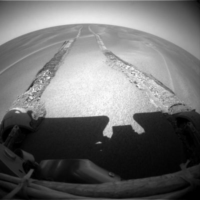 Stuck, in a Sea of Sand: will the "K-turn" help to save the day? (1)
Da "Mars Daily" del 4 Maggio 2005:"The Opportunity Team continues working with an engineering test rover on Earth to determine the safest way to attempt to drive the Rover out of the dune where it's currently parked on Mars. In the meantime, Opportunity is collecting science data with its instruments and cameras.
Opportunity used the PanCam to acquire images of the Rover's far tracks, where Opportunity had performed a successful "K-turn" at the start of the drive on Sol 446.
A "K-turn" is the technique engineers have figured out for safely turning the Rover 180° while the right front wheel is stuck in a position of 7° left of straight ahead.
To turn 180°, the Rover makes smaller arcing movements without cranking the wheels as much as a normal during a 180° turn. These movements create a "K" shape in the soil".
Parole chiave: Mars dunes
