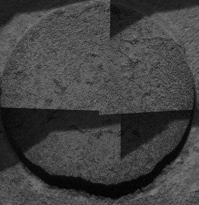 Wind effect - Sol 549
Original caption:"After Opportunity ground a hole in the rock called "Ice Cream" and conducted various scientific experiments, it took this final MI of the hole before driving away. When the image arrived, scientist discovered that the hole had been filled with dust. Apparently, a blast of wind had picked up some of the tailings produced by the grinding of the rover's rock abrasion tool and swept them back into the hole. In recent months, both Rovers have experienced the effects of wind. (...)Opportunity took this mosaic of images on Sol 549 (Aug. 9, 2005). The area shown is approx. 6 cm (about 2,4") wide. (...)".

Nota: abbiamo visionato anche noi alcune centinaia di frames (esaminarli tutti non ci è possibile) in arrivo da Opportunity e, a dispetto di quanto la NASA continua a ripetere, la presenza e l'effetto dei Venti Marziani, nella zona di Meridiani Planum, NON è riscontrabile. 
Quanto riportato nella Caption NASA Originale è, a nostro parere, solo una arditissima speculazione.
Parole chiave: Microscopic Imager - Martian Paving