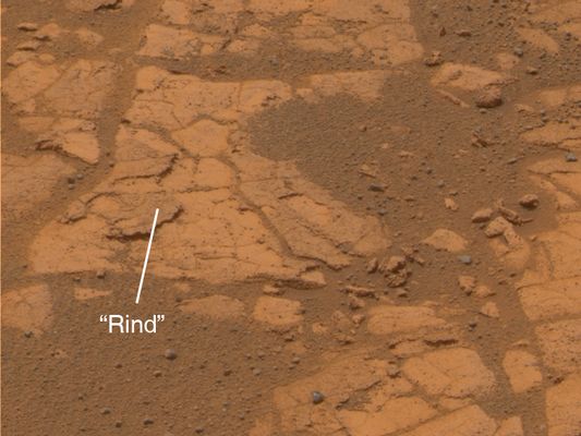 Lemon Rind - Sol 552
Caption NASA originale:"After months spent crossing a sea of rippled sands, Opportunity reached an outcrop in August 2005 and began investigating exposures of sedimentary rocks, intriguing rind-like features that appear to cap the rocks, and cobbles that dot the martian surface locally. Opportunity spent several Martian Days analyzing a feature called Lemon Rind, a thin surface layer covering portions of outcrop rocks poking through the sand north of Erebus Crater. In images from the PanCam, Lemon Rind appears slightly different in color than surrounding rocks. It also appears to be slightly more resistant to wind erosion than the outcrop's interior. This is an approximately true-color composite produced from frames taken during Opportunity's 552nd Sol (Aug. 13, 2005)". 
Parole chiave: Mars rocks, sand and debris