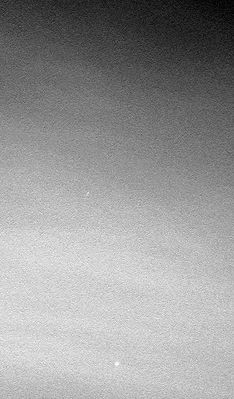 In the lights of the dawn... (1)
Original caption:"Left Pan-Cam Non-linearized Sub-frame EDR acquired on Sol 687 of Opportunity's mission to Meridiani Planum at approximately 04:28:03 MLT.
Camera commanded to use Filter 1 (739 nm)".

Nota: un cielo (almeno in apparenza) abbondantemente rannuvolato accoglie i primissimi bagliori dell'alba? Può darsi.
E l'oggetto che appena riesce a distinguersi nella foschia luminescente? Sarà la Terra o magari Phobos? 

Noi opteremmo - vista la forma e la luminosità - per la (lontana) Terra, ma potremmo sbagliarci...
Parole chiave: Martian Night-Sky - Controversial frame