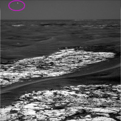 A "Flash" in the sky, or just a photoartifact? - Sol 813
Che cos'è l'oggetto nella Cerchiatura Fucsia? Il "solito" photoartifact che sembra essere un "amico" del Filtro/Colore n. 2 della PanCam Dx del MER Opportunity, oppure un oggetto reale? Noi abbiamo elaborato il frame in questione usando un particolare software che consente di effettuare una "pulizia mirata" dell'immagine, rimuovendo i pixels "innaturali" - e che noi reputiamo essere stati aggiunti allo scopo di alterare l'immagine - e lasciando in situ quelli (presumibilmente) "autentici ed originali".
Risultato: abbiamo notato che la porzione superiore del lampo è formata da pixels (che sembrano) originali, mentre quella inferiore è formata da pixels (che sembrano) aggiunti. 
Morale: se si esamina solo la porzione superiore del flash, si direbbe che esso è il riflesso fotografico di un evento reale; se si guarda, invece, solo quella inferiore, si direbbe che è un photoartifact.

Impossibile fare ulteriori commenti.
Parole chiave: Mars Panorama - Controversial