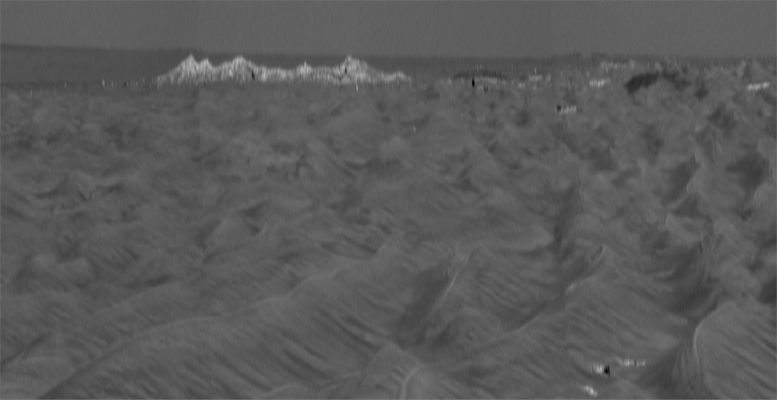 Beagle Crater (stretched version) - Sol 855
Caption NASA originale:"When scientists using orbital data calculated that they should be able to detect Victoria's rim in Rover images, they scrutinized frames taken in the direction of the crater by the PanCam. To positively characterize the subtle horizon profile of the crater and some of the features leading up to it, researchers created this vertically-stretched image. The stretched image makes mild nearby dunes look like more threatening peaks, but that is only a result of the exaggerated vertical dimension. This vertical stretch technique was first applied to Viking Lander 2 panoramas by Philip Stooke, of the University of Western Ontario, Canada, to help locate the Lander with respect to orbiter images. Vertically stretching the image allows features to be more readily identified by the MER Science Team". 
Parole chiave: Martian Panorama - Beagle Crater