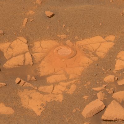 Baltra - Sol 896
NASA's MER Opportunity recently stopped to analyze an exposure of rock near Beagle Crater, on a target nicknamed Baltra. Nearly 100 Soles have passed since Opportunity had last analyzed one of the now-familiar rock exposures seen on the Plains of Meridiani. The Rover ground a mm-deep (0,12"-deep) hole in the rock using the RAT on Sol 893 (July 29, 2006) while stationed about 25 mt (82 feet) from the South-West rim of Beagle Crater. 
Scientists wanted to analyze the outcrop one more time before driving the Rover onto the ring of smooth material surrounding Victoria Crater. Opportunity's analysis showed the rock to be very similar in its elemental composition to other exposures encountered during the Rover's Southward trek across Meridiani Planum. 
Opportunity acquired the image data shown here shortly after noon on Mars on Sol 896 (Aug. 1, 2006) with the PanCam after backing up 1 mt (3,3 feet) from Baltra to make sure that the target was in full Sunlight. 

This is an approximately true-color Pancam image, generated from mathematical combinations of calibrated left-eye images using filters ranging from 432-nanometer to 753-nanometer wavelengths.
Parole chiave: Mars rocks, sand and debris - proximities of Beagle Crater